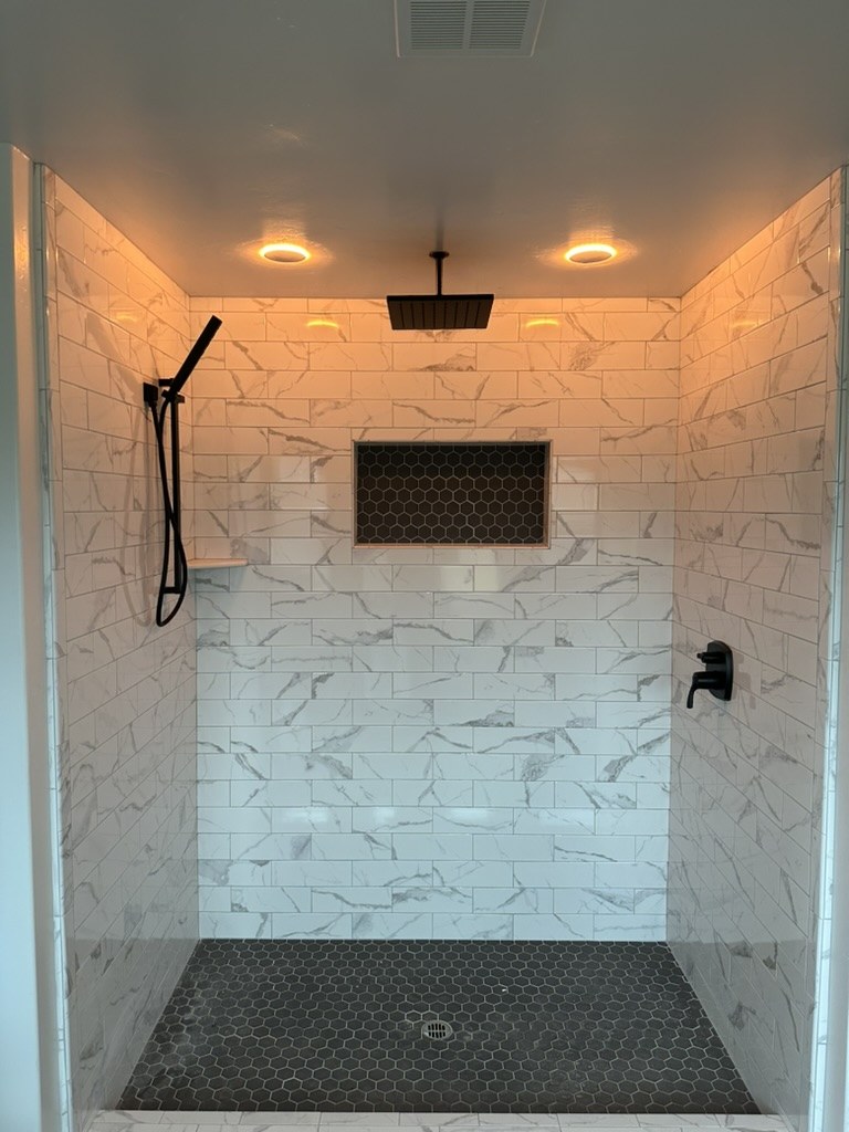 Finished shower with two recessed lights