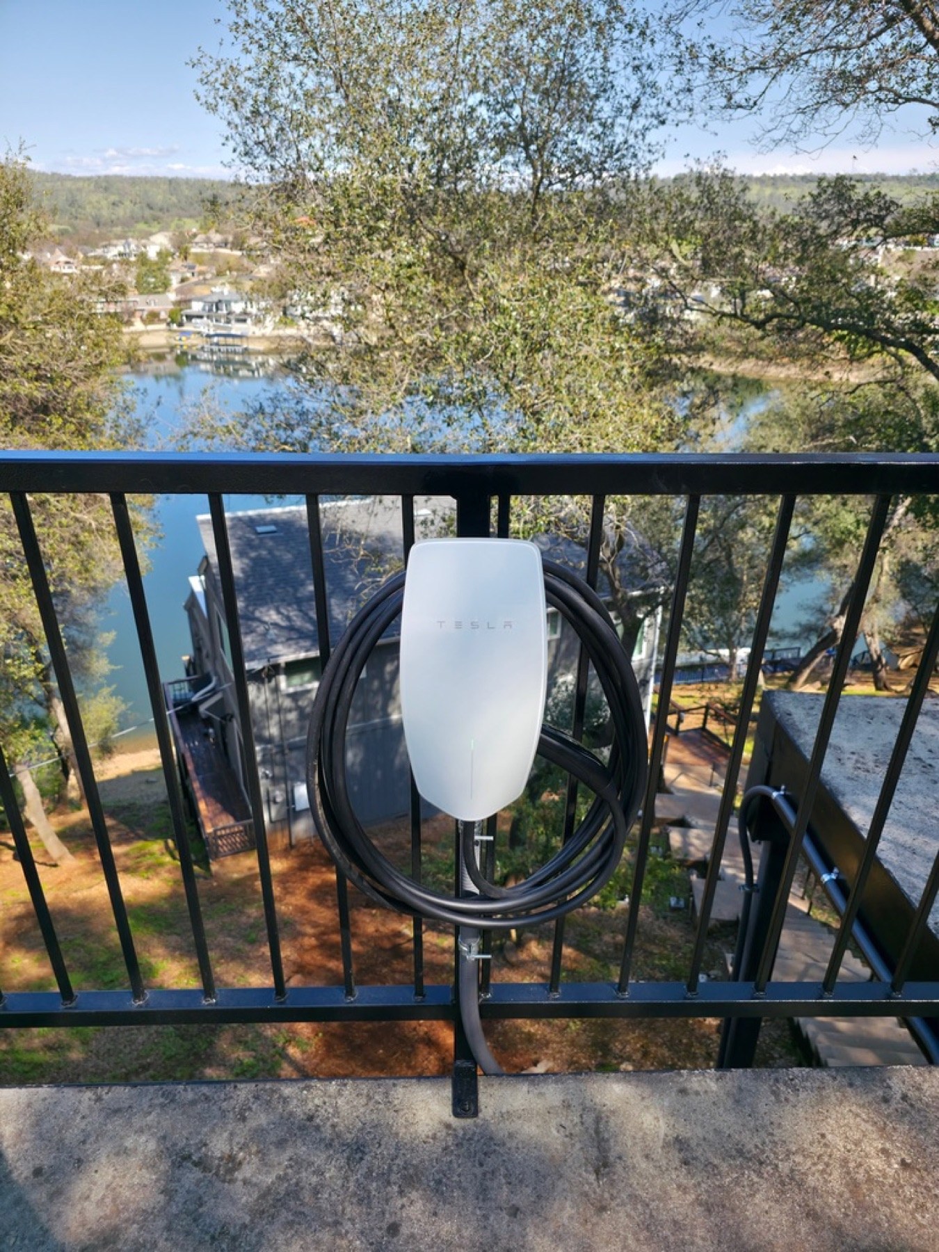 Tesla Wall Connector installed at a lakeside property