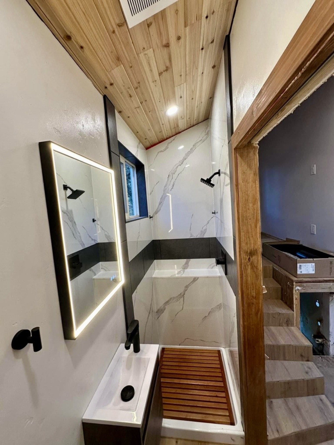 Finished tiny-home bathroom with recessed lighting